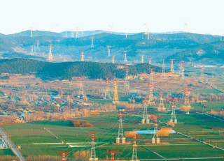 China unveils first integrated wind-solar-thermal UHV power project